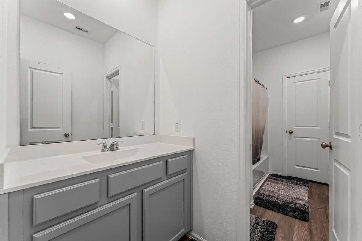 Bathroom, Dual Sink Vanities, Interior, Recessed Lighting, Wood Texture Flooring