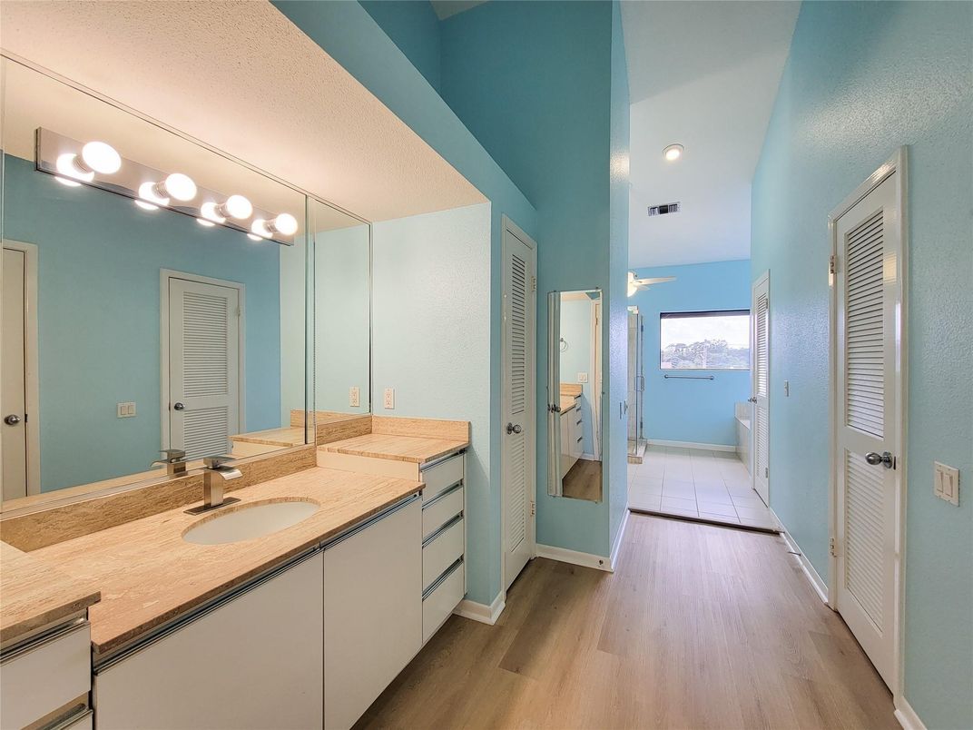Bathroom, Dual Sink Vanities, Interior, Recessed Lighting, Wood Texture Flooring