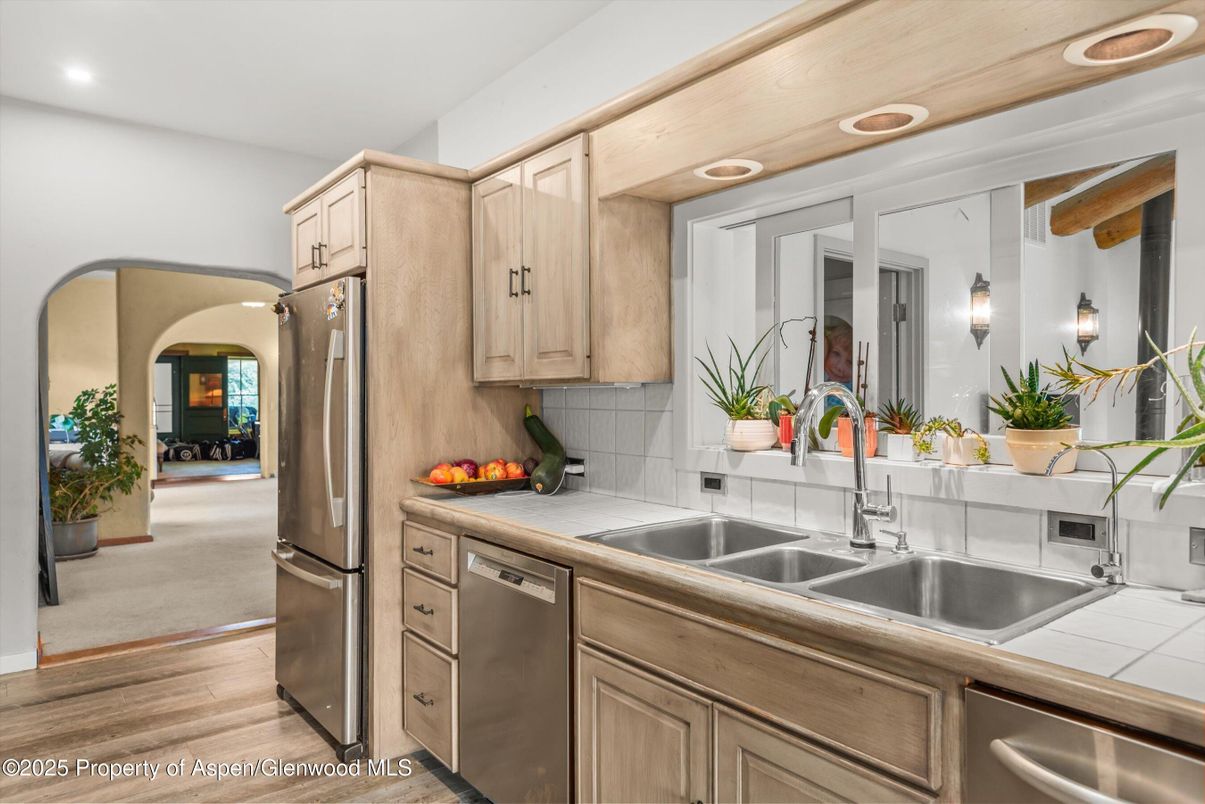 Interior, Kitchen, Recessed Lighting, Stainless Steel Appliances, Tile Countertops, Wood Texture Flooring