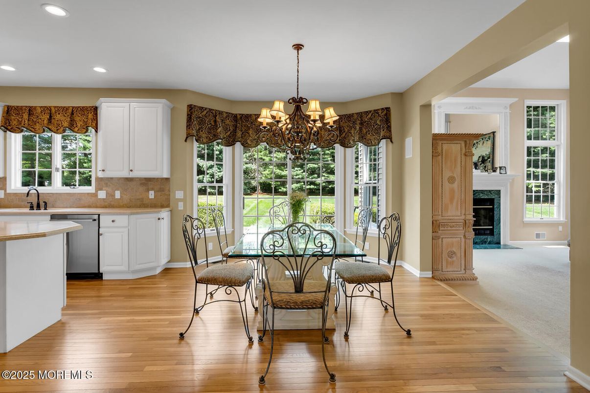 Chandelier, Dining room, Fireplace, Interior, Kitchen, Recessed Lighting, Wood Texture Flooring