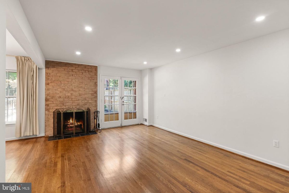 Empty room, Fireplace, Interior, Recessed Lighting, Stone Walls, Wood Texture Flooring