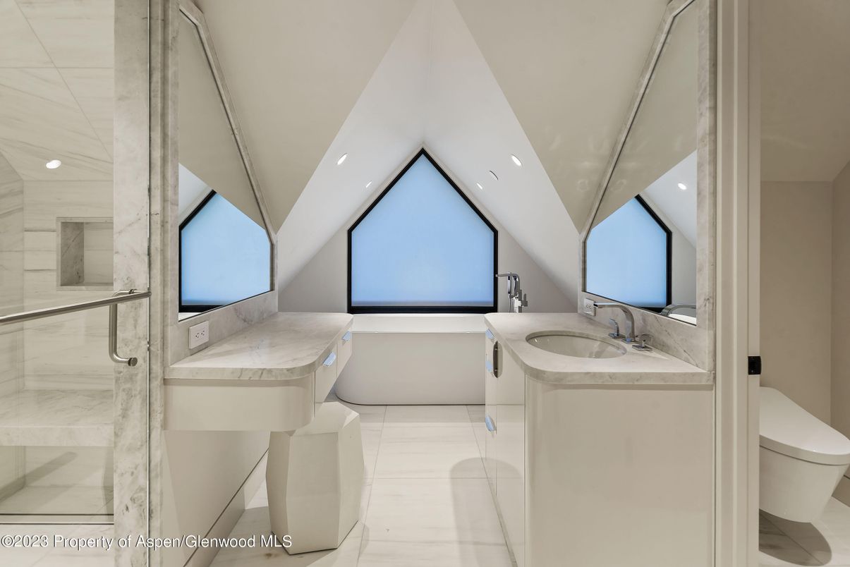 Bathroom, Dual Sink Vanities, Free Standing Baths, Glass Shower, Interior, Marble, Marble Walls, Recessed Lighting