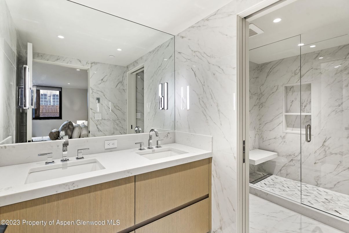 Bathroom, Dual Sink Vanities, Glass Shower, Interior, Marble, Marble Walls, Recessed Lighting