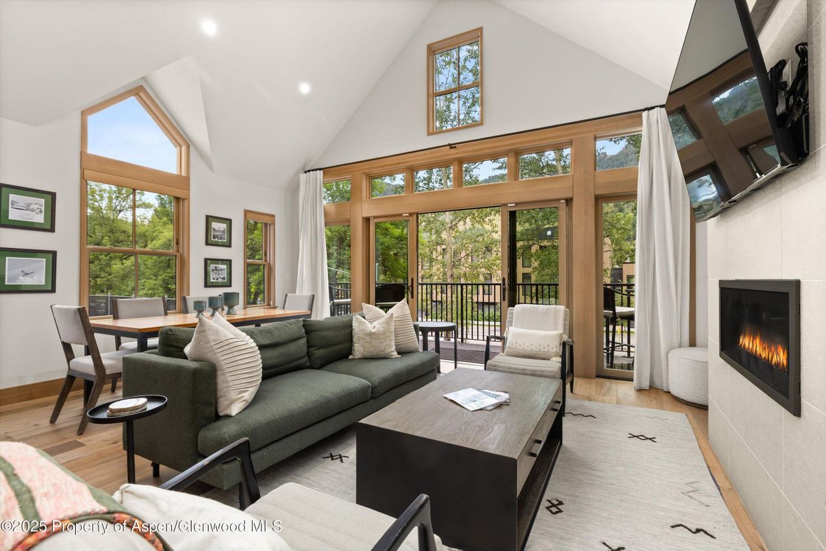 Dining room, Fireplace, Interior, Living room, Recessed Lighting, Wood Texture Flooring