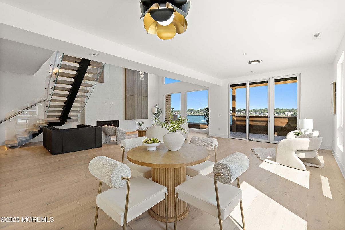 Dining room, Fireplace, Interior, Living room, Recessed Lighting, Water, Wood Texture Flooring