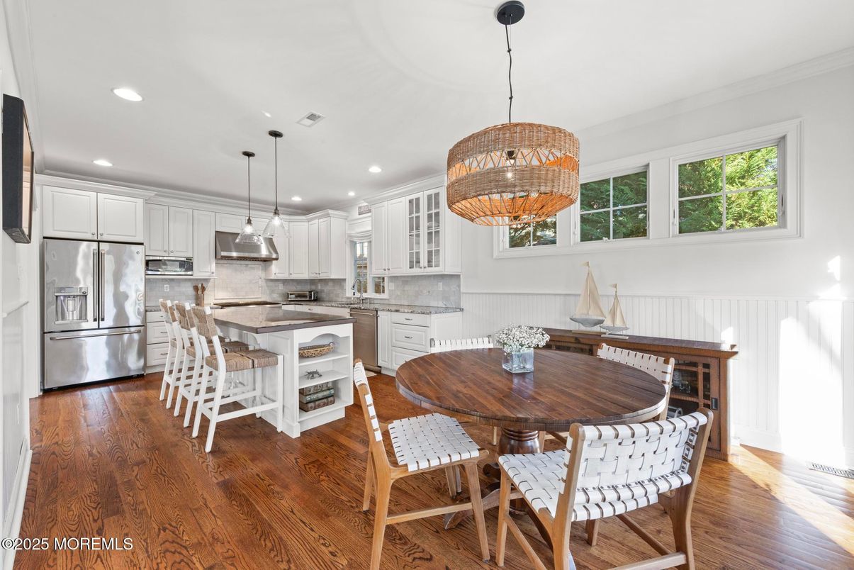 Chandelier, Dining room, Interior, Kitchen, Pendant Lights, Recessed Lighting, Stainless Steel Appliances, Wood Texture Flooring