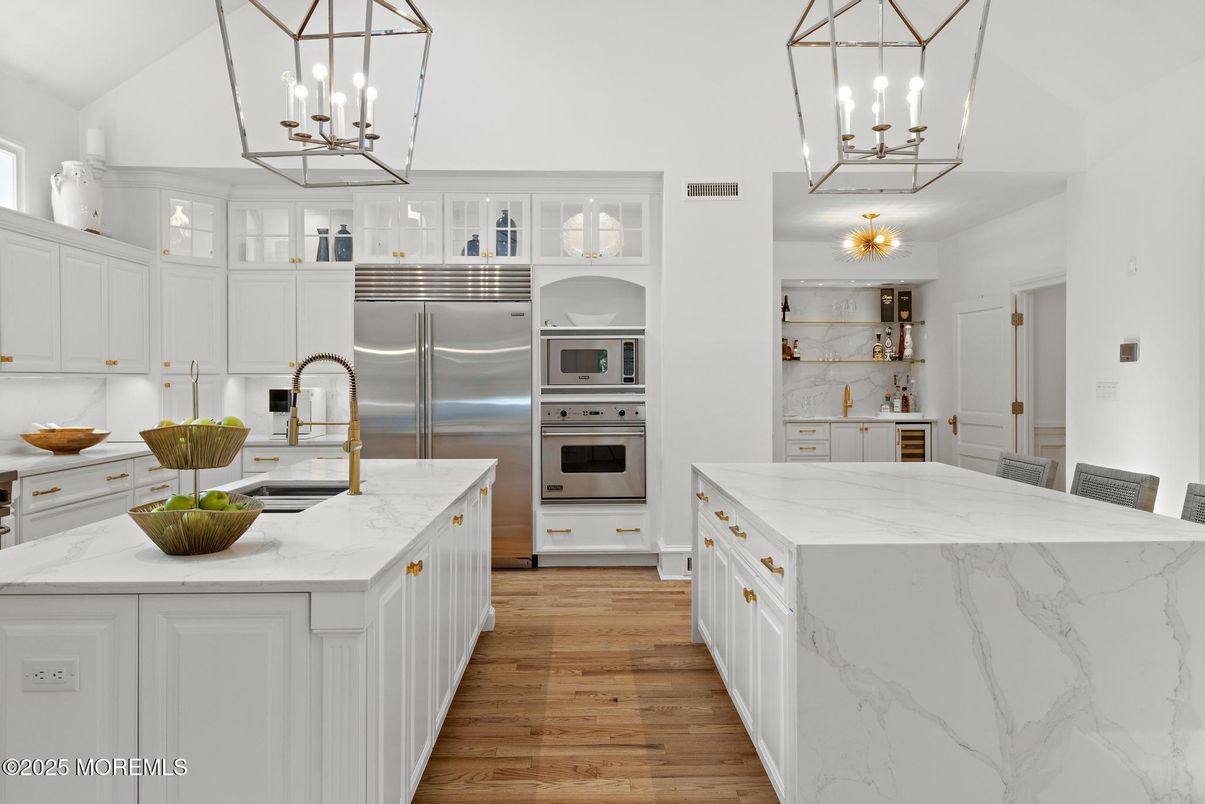 Interior, Kitchen, Marble Walls, Pendant Lights, Stainless Steel Appliances, Wood Texture Flooring