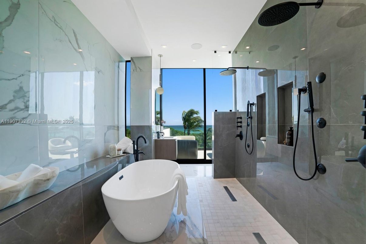 Bathroom, Free Standing Baths, Glass Shower, Interior, Marble Walls, Recessed Lighting, Water