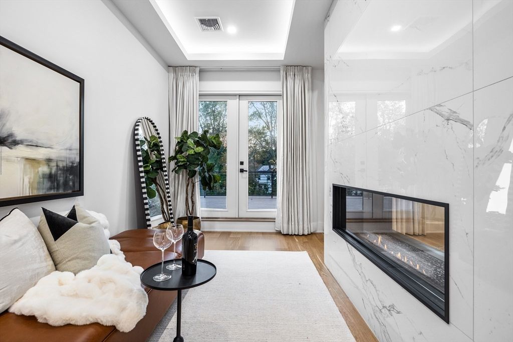 Fireplace, Interior, Marble Walls, Recessed Lighting, Wood Texture Flooring