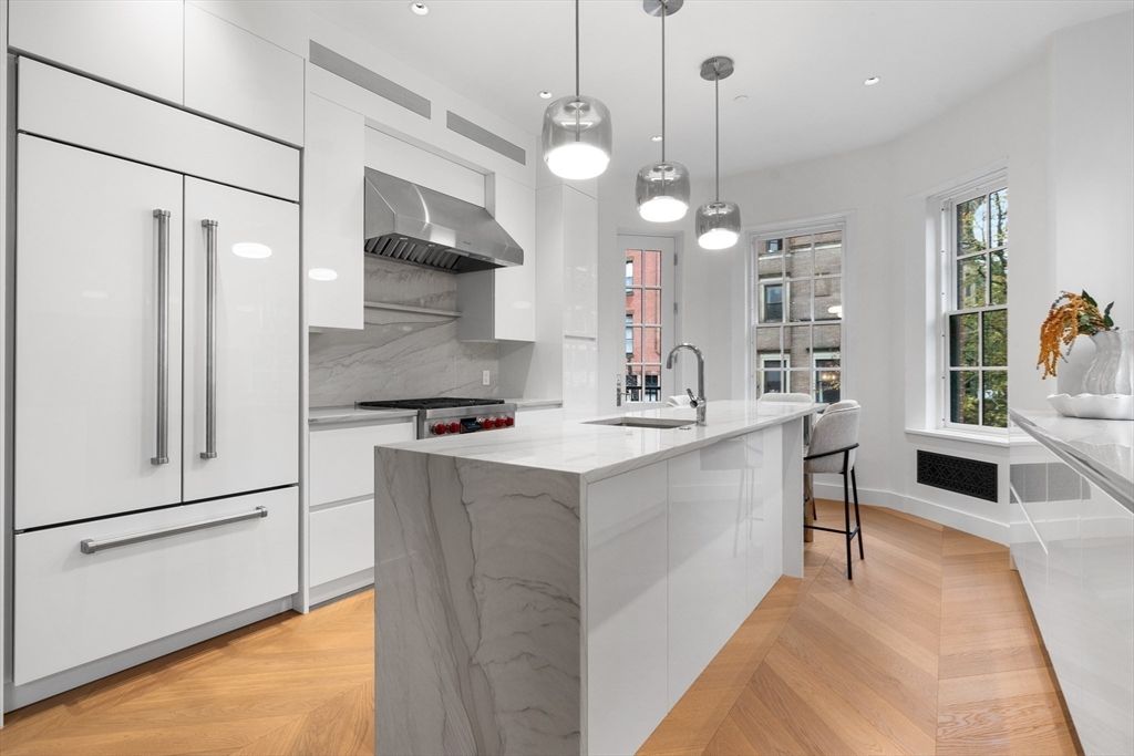 Interior, Kitchen, Marble Walls, Pendant Lights, Recessed Lighting, Stainless Steel Appliances, Wood Texture Flooring