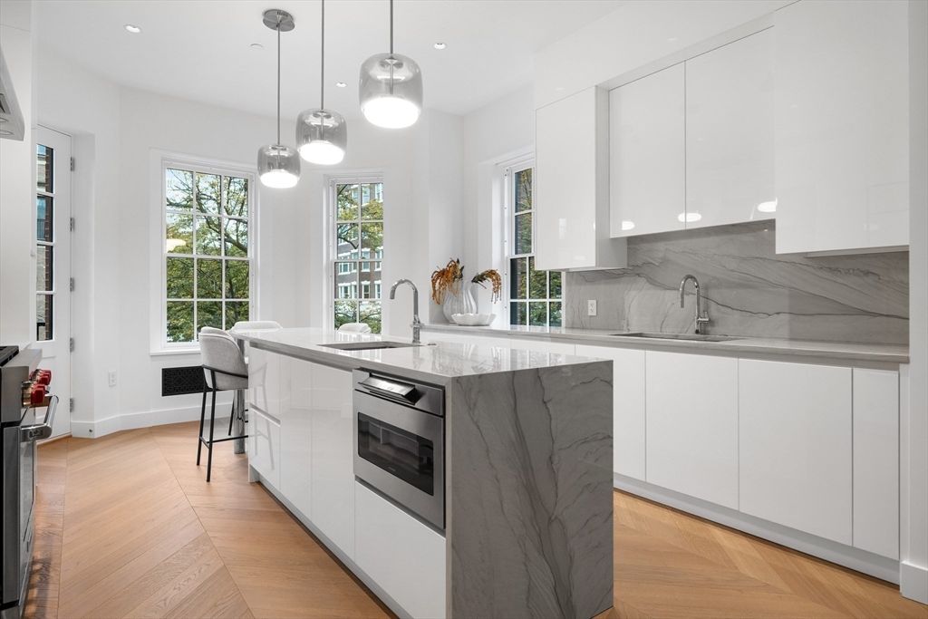 Interior, Kitchen, Marble Walls, Pendant Lights, Recessed Lighting, Stainless Steel Appliances, Wood Texture Flooring