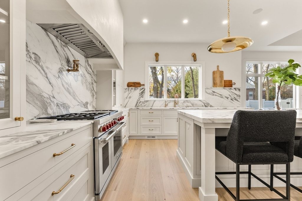 Interior, Kitchen, Marble Walls, Pendant Lights, Recessed Lighting, Stainless Steel Appliances, Wood Texture Flooring