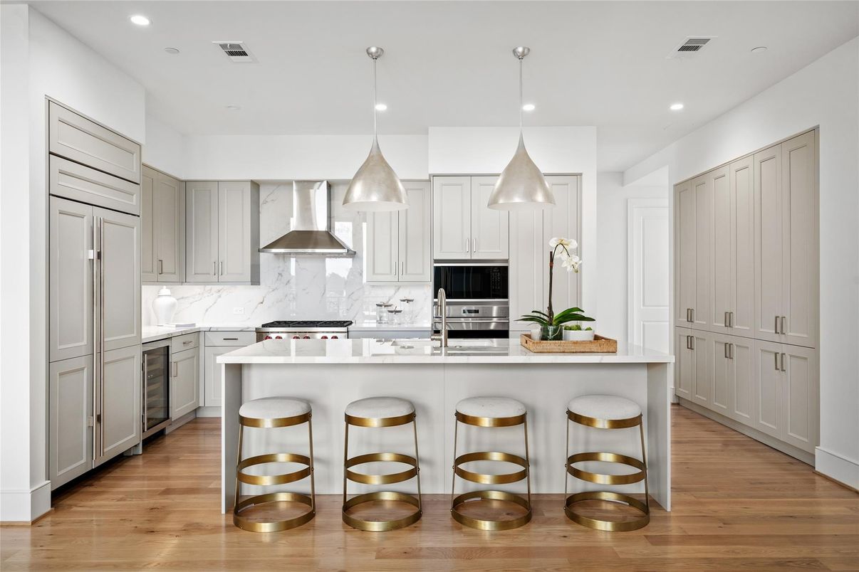 Interior, Kitchen, Marble Walls, Pendant Lights, Recessed Lighting, Stainless Steel Appliances, Wood Texture Flooring