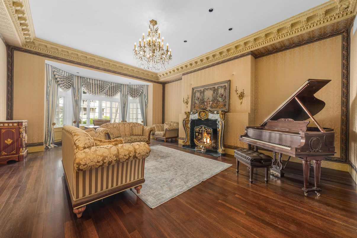 Chandelier, Fireplace, Interior, Living room, Piano, Recessed Lighting, Wood Texture Flooring