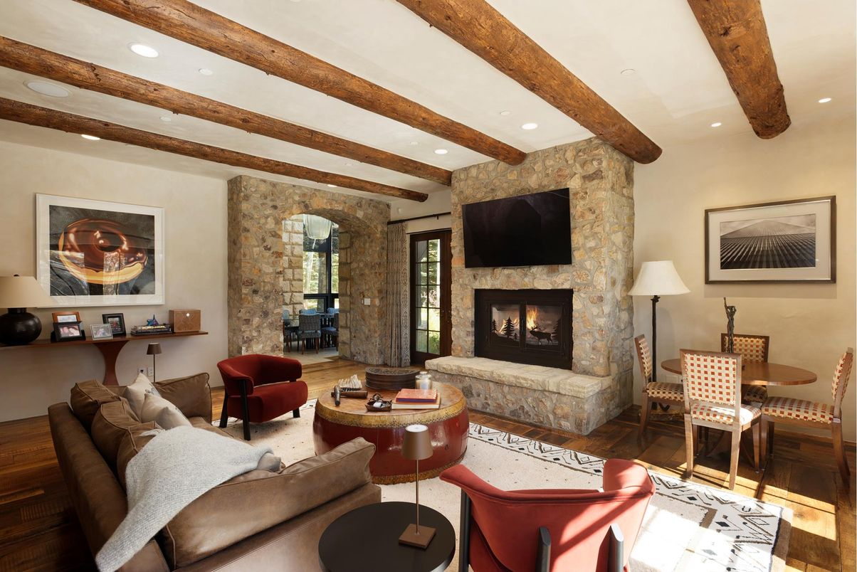 Dining room, Fireplace, Interior, Living room, Recessed Lighting, Stone Walls, Wooden Beams, Wood Texture Flooring